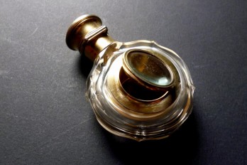 Smelling salts bottle and magnifying glass, early 19th century
