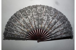 Black flowers, lace fan late 19th century