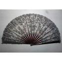 Black flowers, lace fan late 19th century