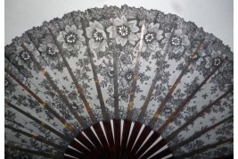 Black flowers, lace fan late 19th century