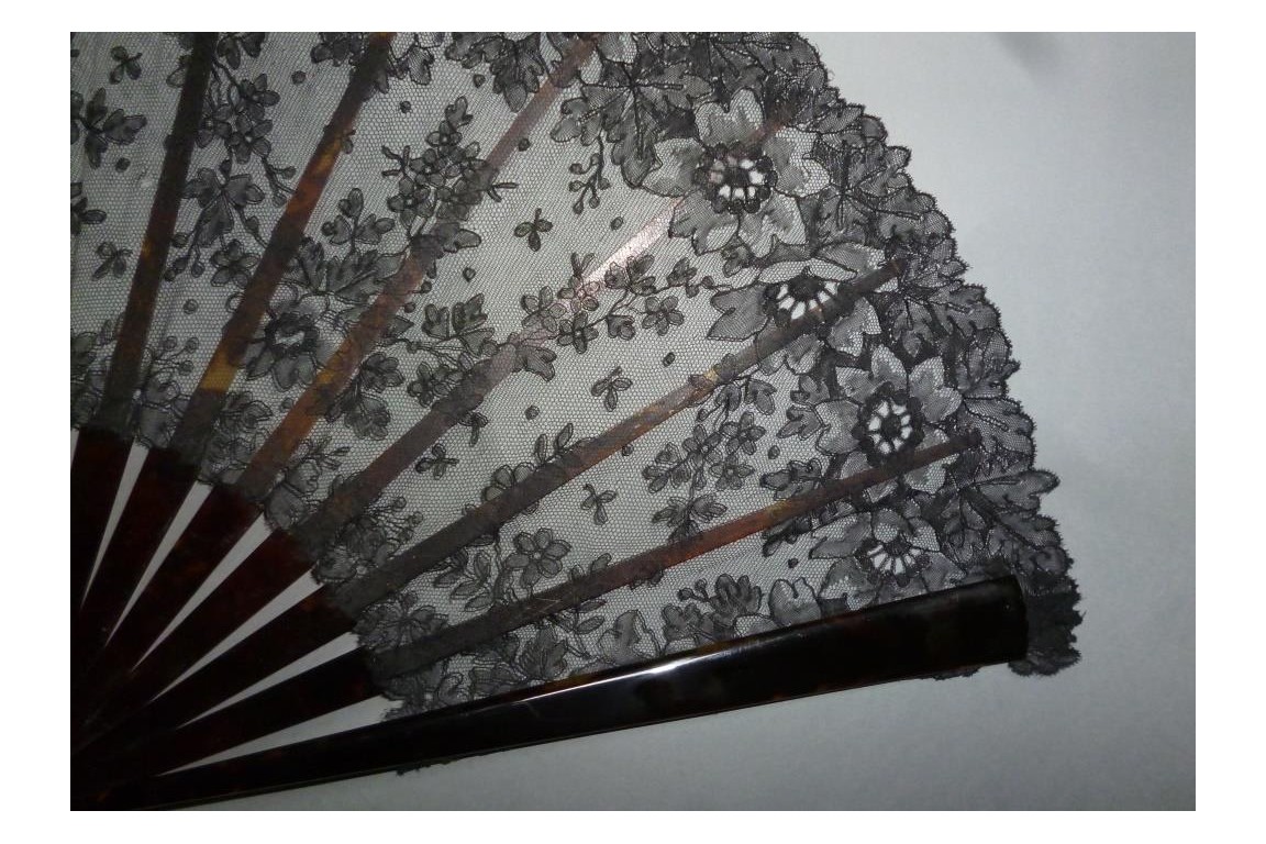 Black flowers, lace fan late 19th century