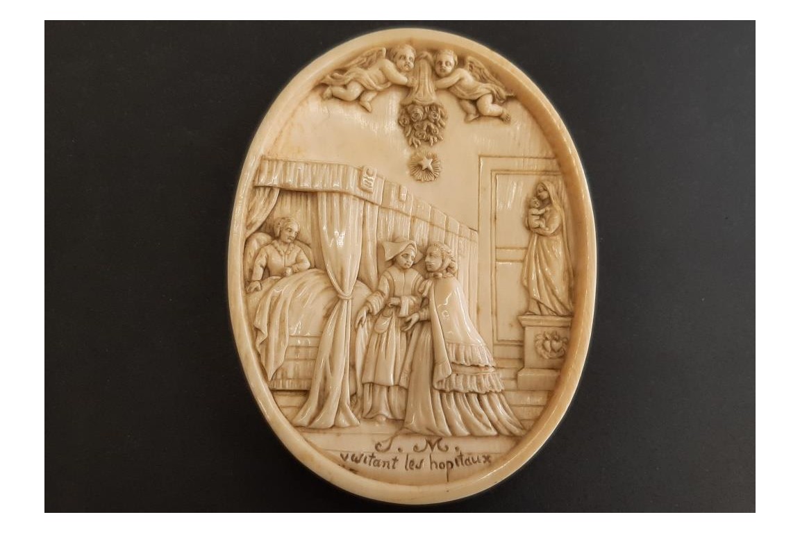 Empress Eugénie visiting the sick, medallion circa 1866