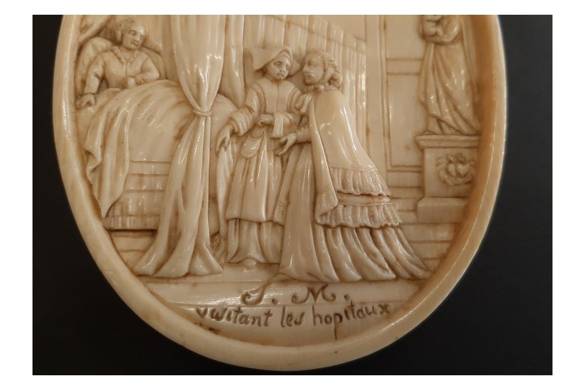 Empress Eugénie visiting the sick, medallion circa 1866
